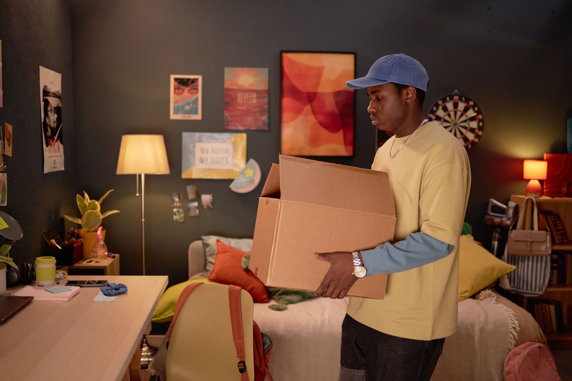 Person Holding Moving Boxes in Stylish Room Setting